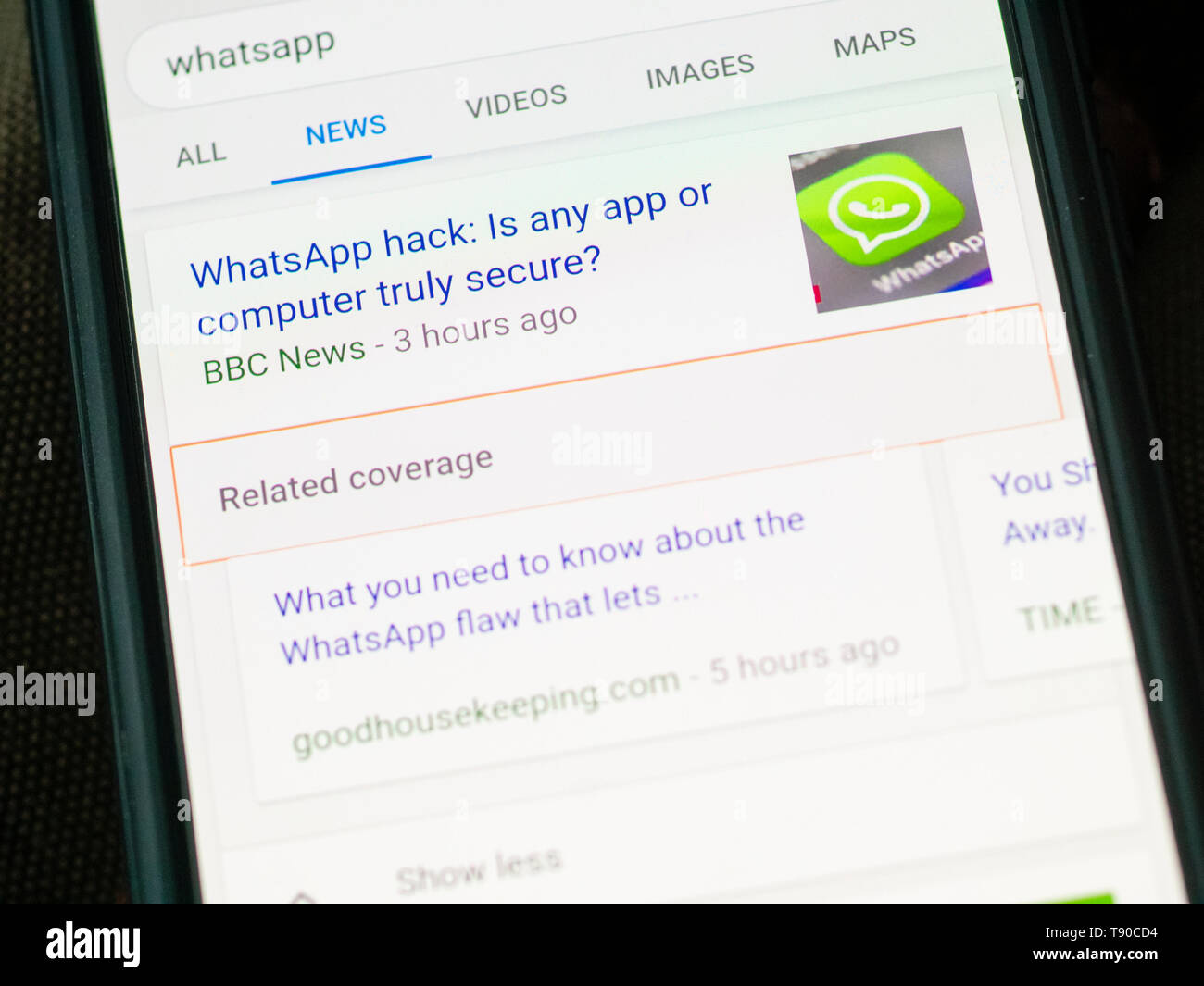 WhatsApp Messenger on a Smartphone, WhatsApp allows users to encrypt their calls and messages for privacy. It is owned by Facebook and founded in 2009 Stock Photo