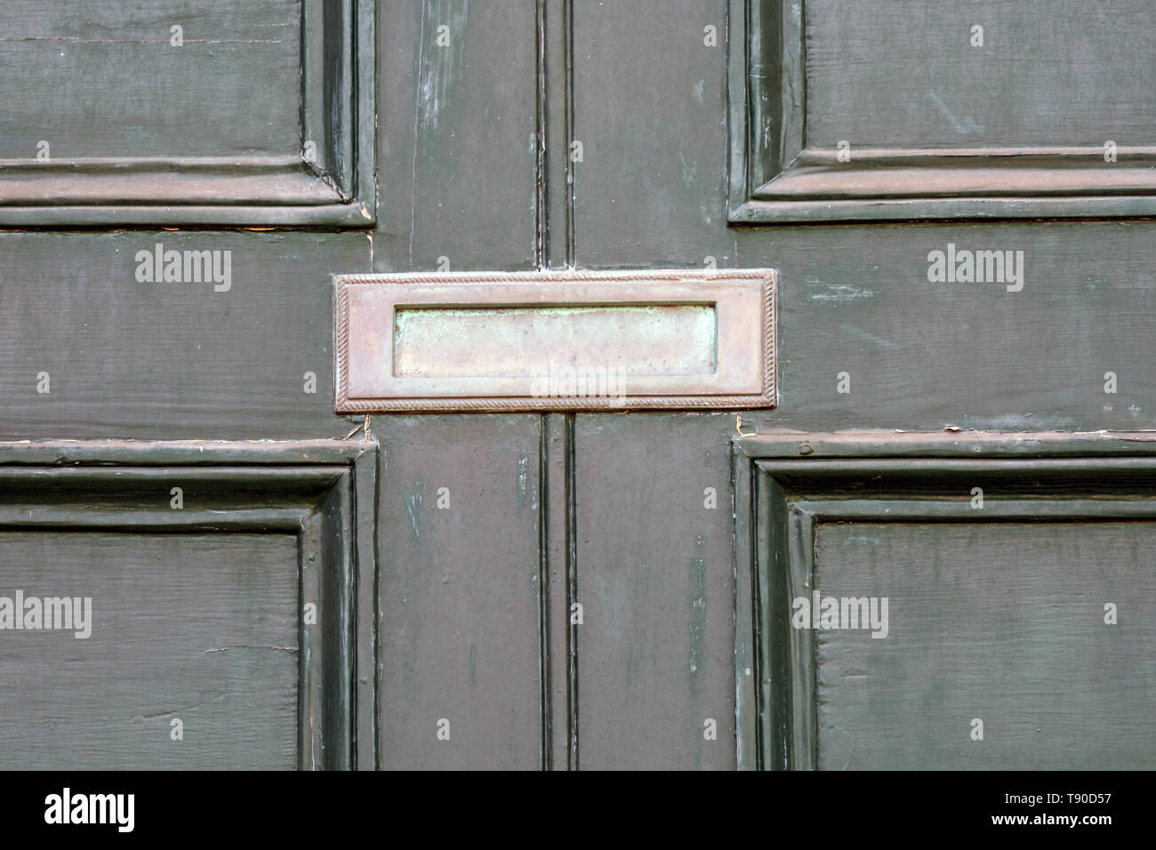 Old Green Front Door Of Victorian House In State Of Disrepair With