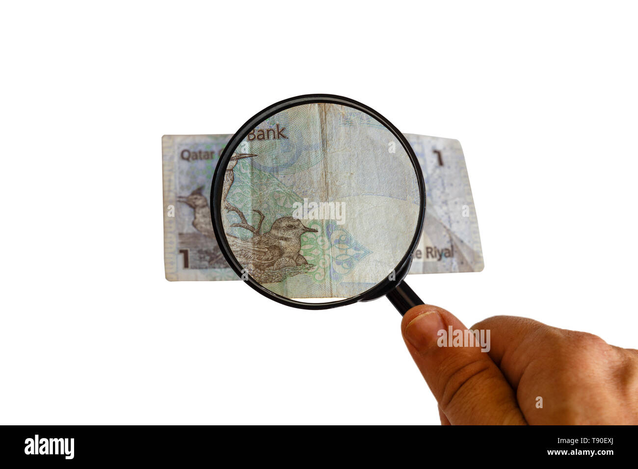 one Qatar Riyal and magnifying glass in hand isolated on white
