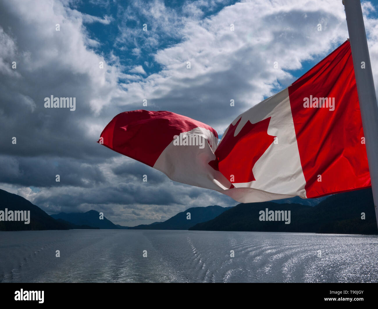 Canadian flag from stern of Inside Passage Ferry, British Columbia Sept 2010 Stock Photo