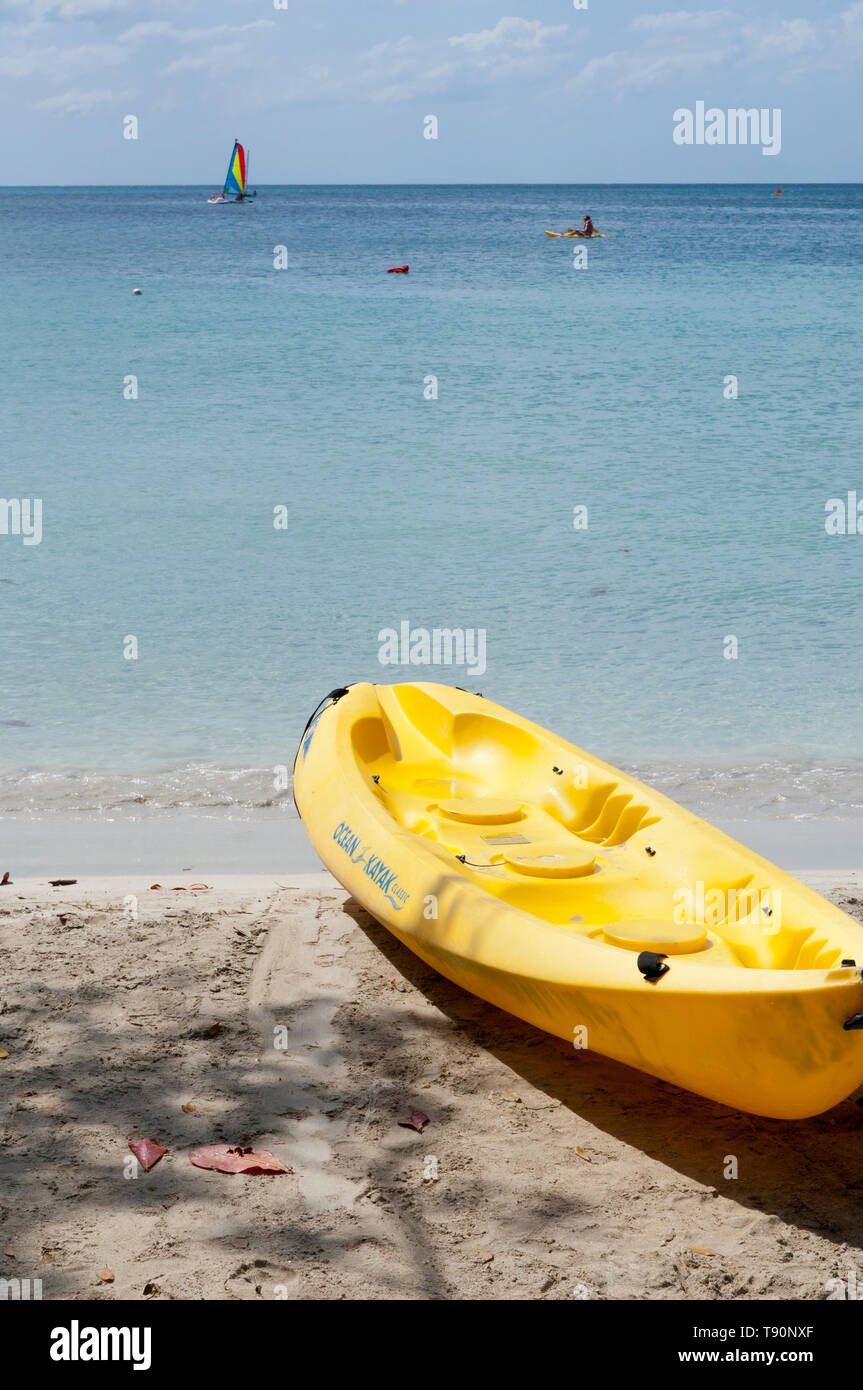 Yellow kayaks on the beach with turquoise Caribbean sea Stock Photo - Alamy