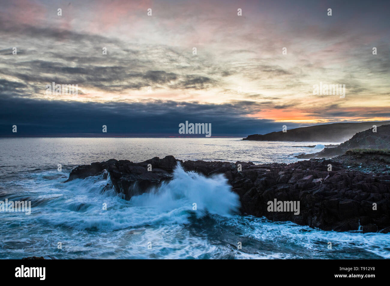 Sunset on the ocean in St. Bride's, Newfoundland, Canada, red sky and a