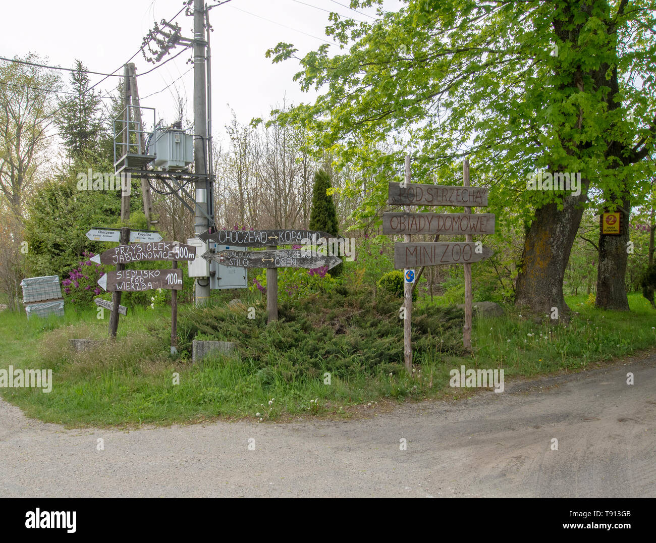 KIERZKOWO, POLAND; 15th MAY 2019: Wooden handmade signposts in the ...