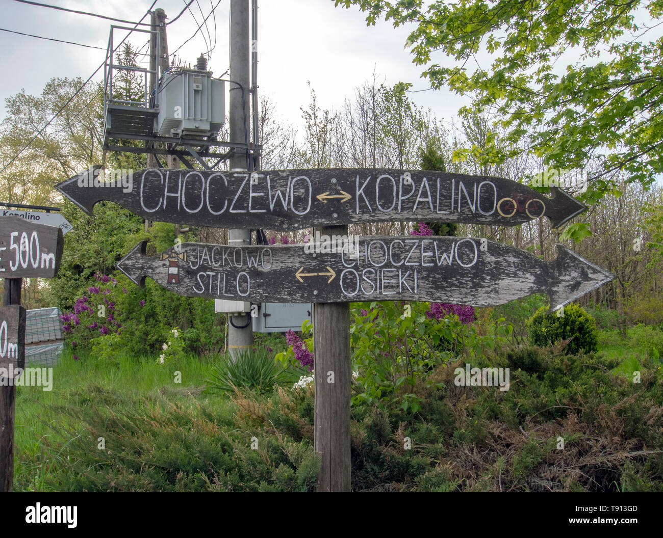 KIERZKOWO, POLAND; 15th MAY 2019: Wooden handmade signposts in the ...