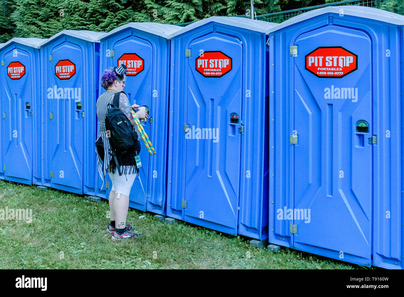 line of portable toilets at Festival, Stock Photo
