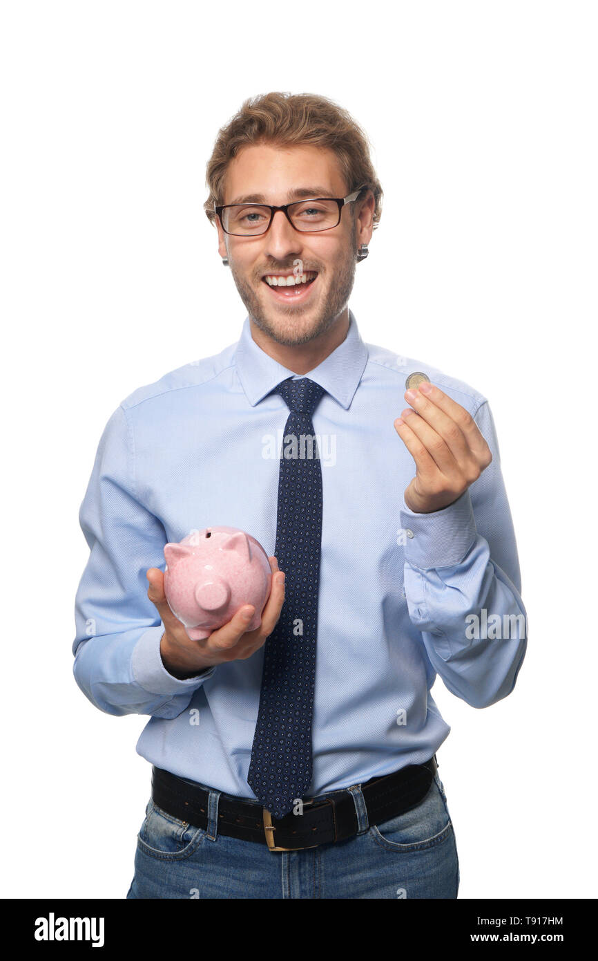 Handsome man with piggy bank on white background Stock Photo - Alamy