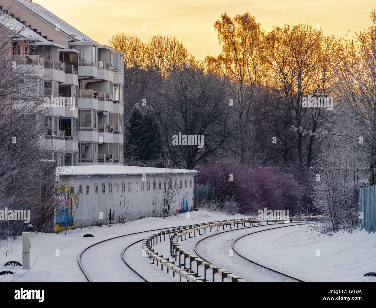 Early winter morning at Lambertseter, a suburb of Oslo, Norway. The railway track is the Oslo Metro system, T-Banen. Stock Photo