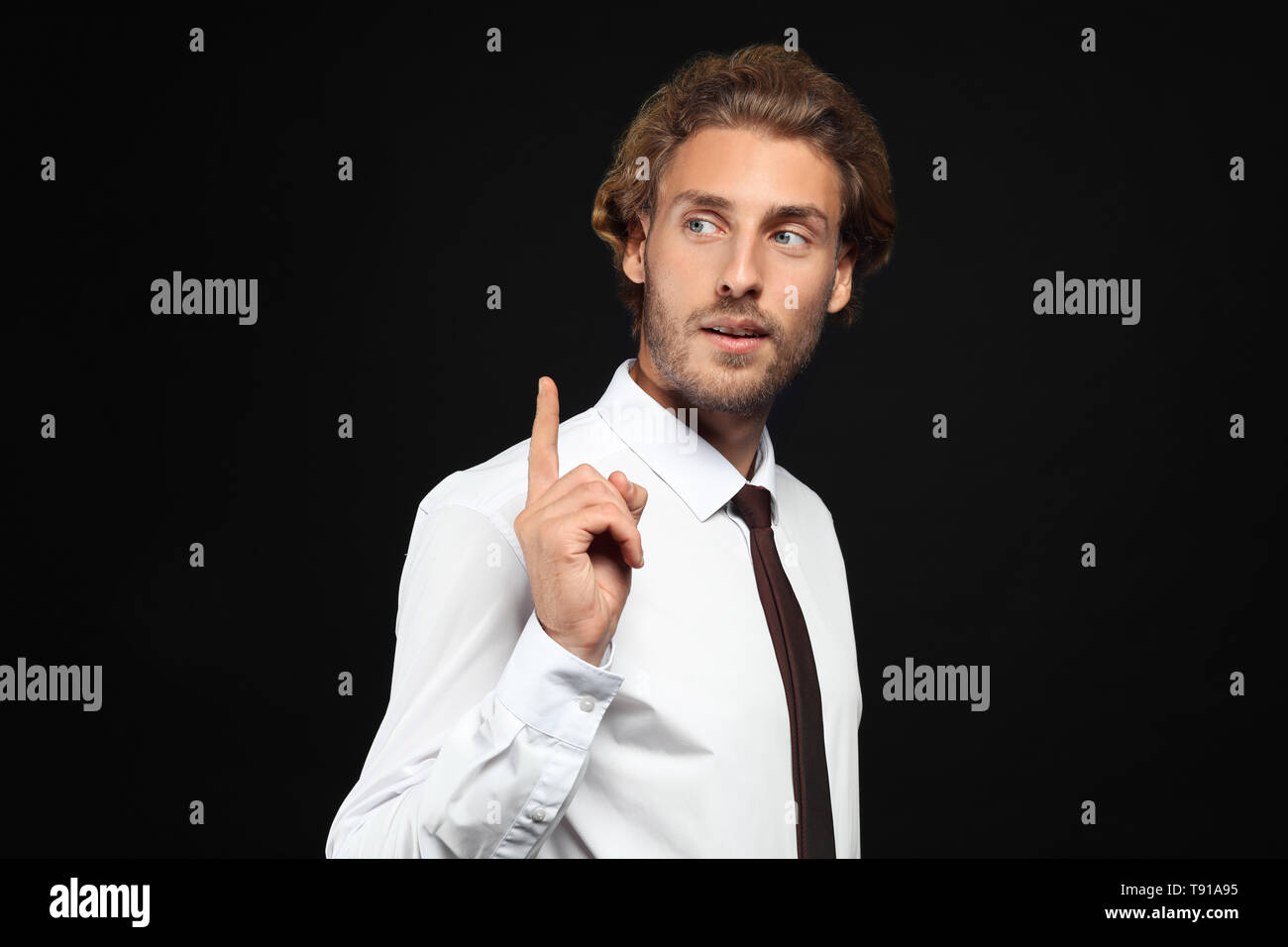 Businessman man raised index finger hi-res stock photography and images ...