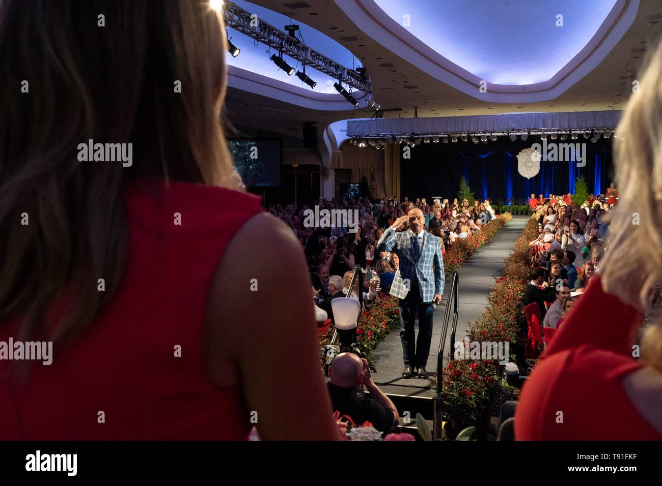 Singer Lee Greenwood salutes First Lady Melania Trump after performing God Bless the USA during the Congressional Spouses Luncheon at the Washington Hilton Hotel May 14, 2019 in Washington, D.C. Stock Photo
