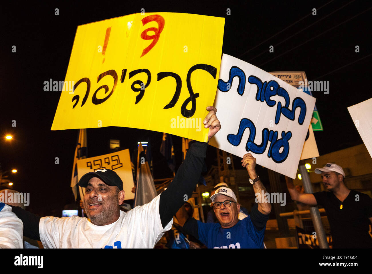 April 7, 2019 - Be'Er Sheva, Israel - Members seen with placards chanting during the rally.Members of the Israeli Likud Party rally in support of Prime Minister, Benjamin Netanyahu, in Be'er Sheva, Israel. Credit: Ronen Tivony/SOPA Images/ZUMA Wire/Alamy Live News Stock Photo