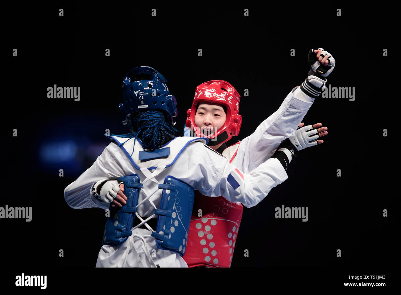 Manchester. 15th May, 2019. South Korea's Da-bin Lee (R) reacts as she competed against France's Marie Paule Ble in the Women -73kg category semifinal fight at the World Taekwondo Championships 2019 in Manchester, Britain on May 15, 2019. Credit: Jon Super/Xinhua/Alamy Live News Stock Photo
