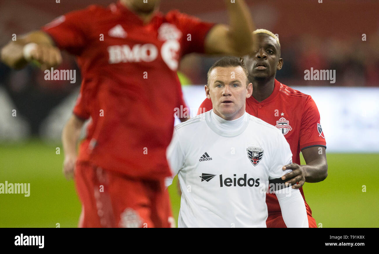 Toronto, Canada. 15th May, 2019. Wayne Rooney (2nd R) of D.C. United is double-teamed during their 2019 Major League Soccer (MLS) match at BMO Field in Toronto, Canada, May 15, 2019. Credit: Zou Zheng/Xinhua/Alamy Live News Stock Photo