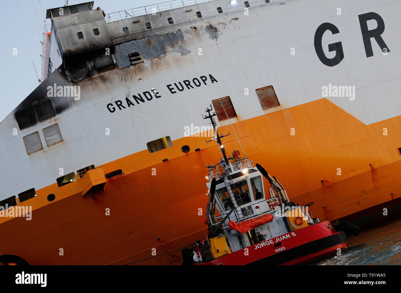 Palma, Spain. 16th May, 2019. The cargo ship 'Grande Europa' of the Italian company 'Grimaldi Lines' burned down yesterday near Mallorca when it was traveling from Sardinia to Valencia loaded with 1,843 cars. The crew was rescued and the ship was towed to the port of Palma without any incidents Credit: Clara Margais/dpa/Alamy Live News Stock Photo