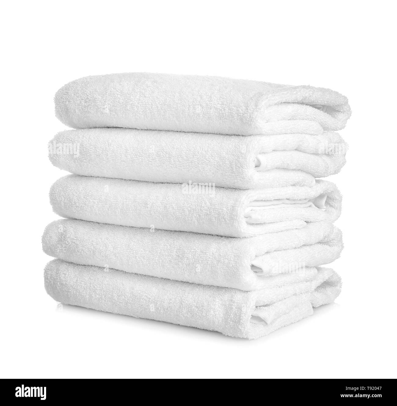 Stack of clean towels on white background Stock Photo Alamy