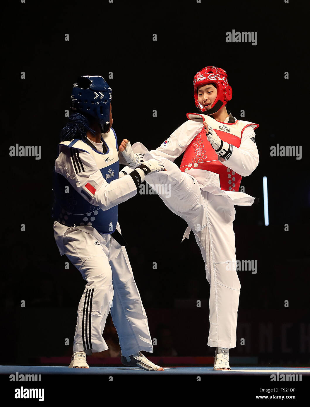 Korea's Da-bin Lee (right) on her way to winning her semi final of the Women's -73kg against France's Marie Paule Ble, during the World Taekwondo Championships at Manchester Arena. Stock Photo