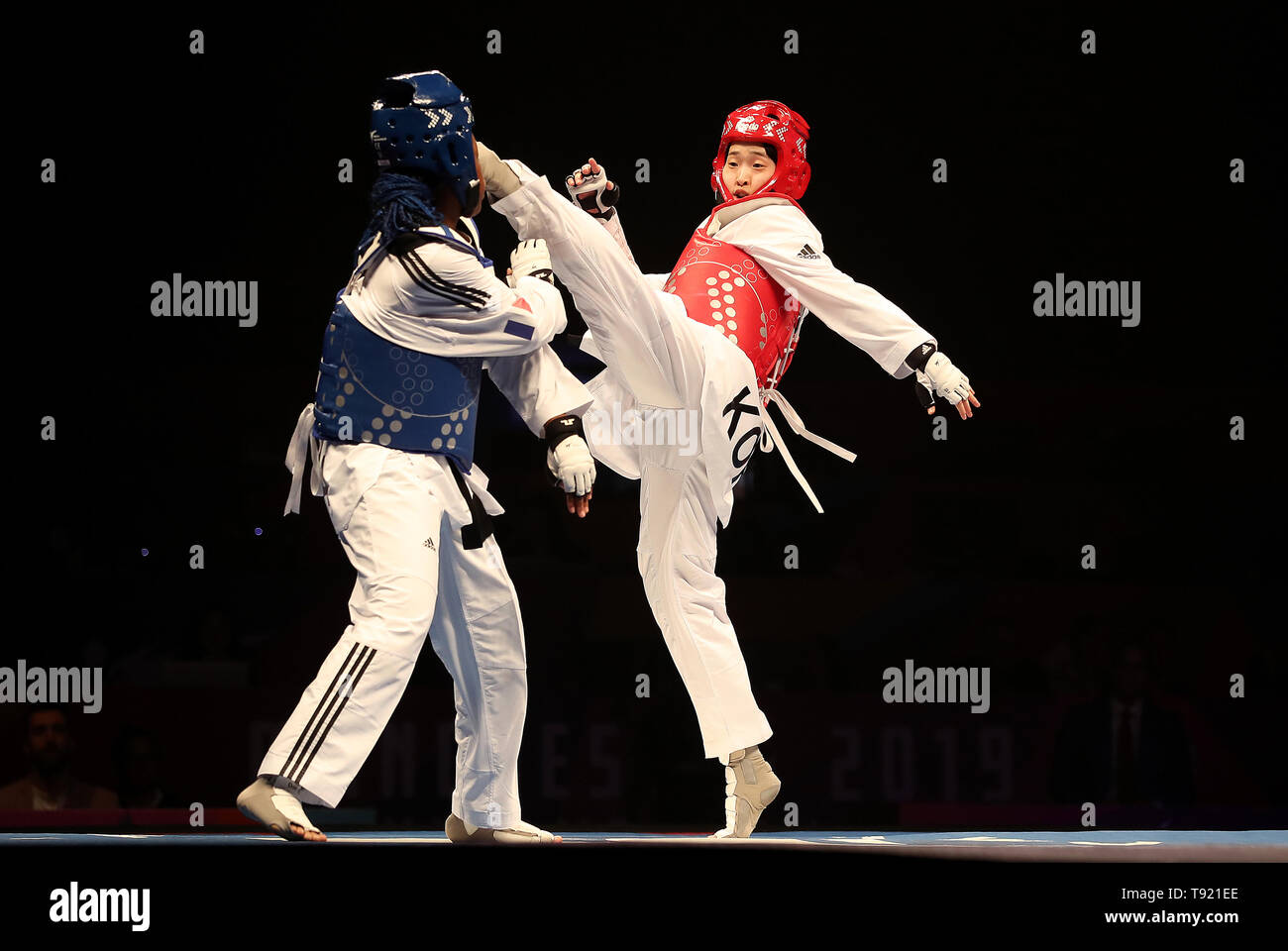 Korea's Da-bin Lee (right) celebrates a point on her way to winning her semi final of the Women's -73kg against France's Marie Paule Ble, during the World Taekwondo Championships at Manchester Arena. Stock Photo
