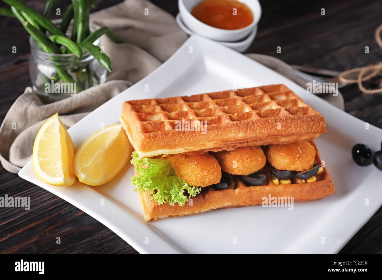 Delicious Waffles With Chicken Nuggets On Plate Stock Photo Alamy