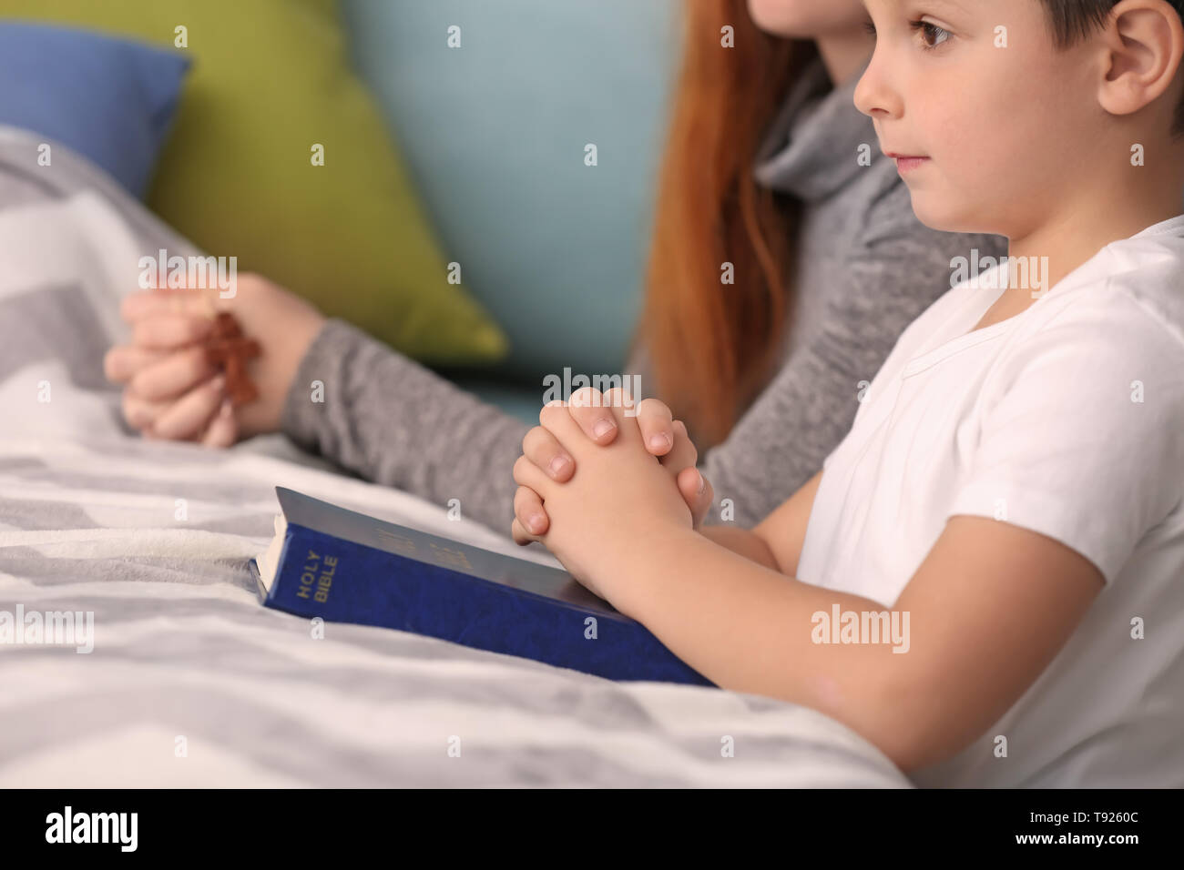 Little boy and his mother praying in bedroom Stock Photo - Alamy