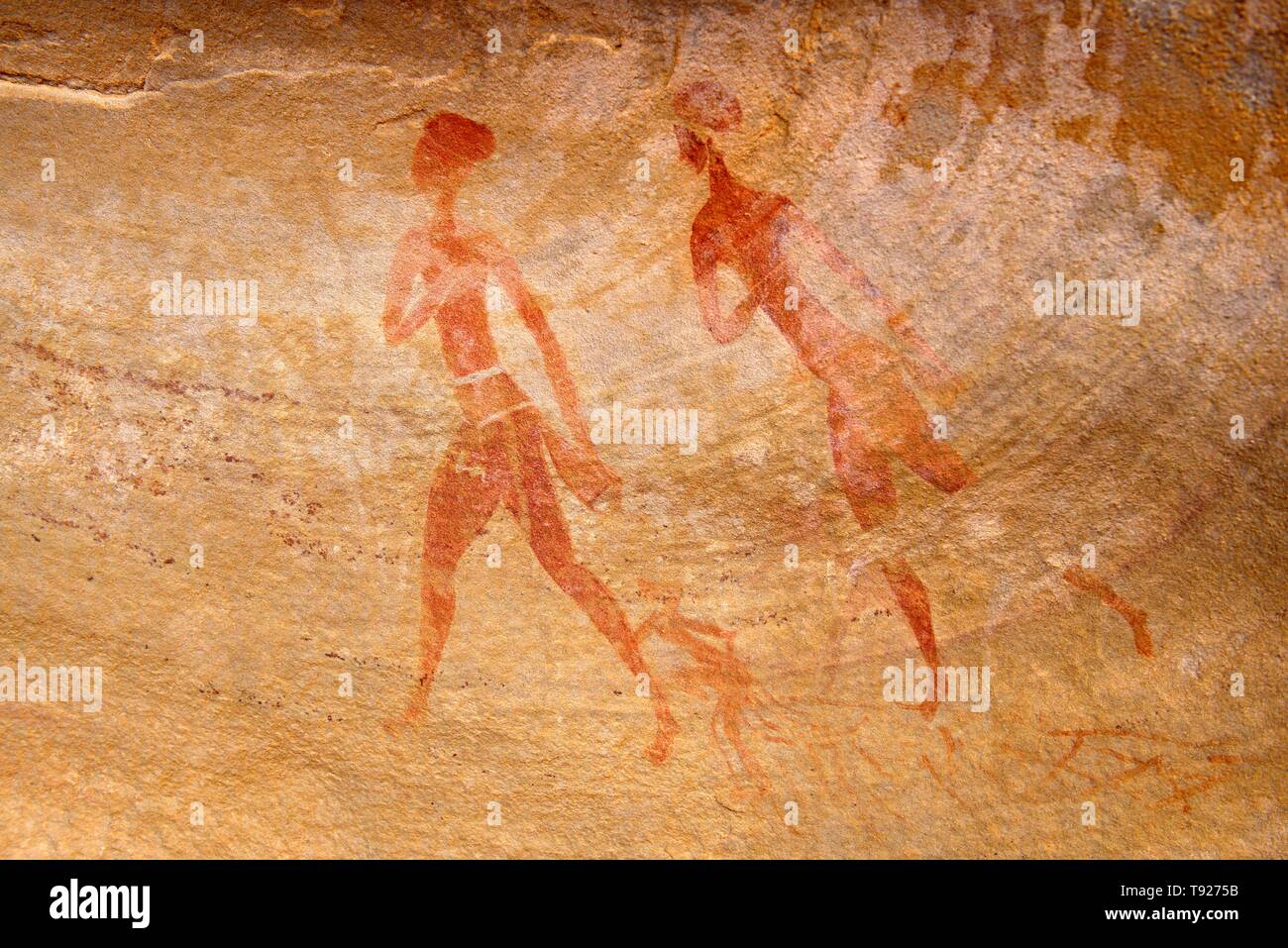Neolithic rock painting, two people, Abaniora style, Tin Abenhar, Tadjelahine Plateau, Tassili n'Ajjer National Park, Unesco World Heritage Site Stock Photo