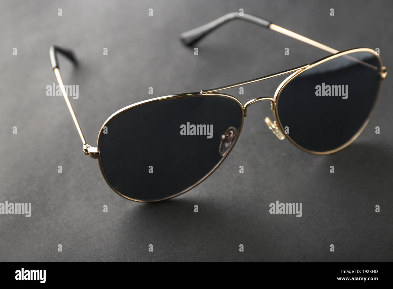 Stylish sunglasses on black background Stock Photo - Alamy