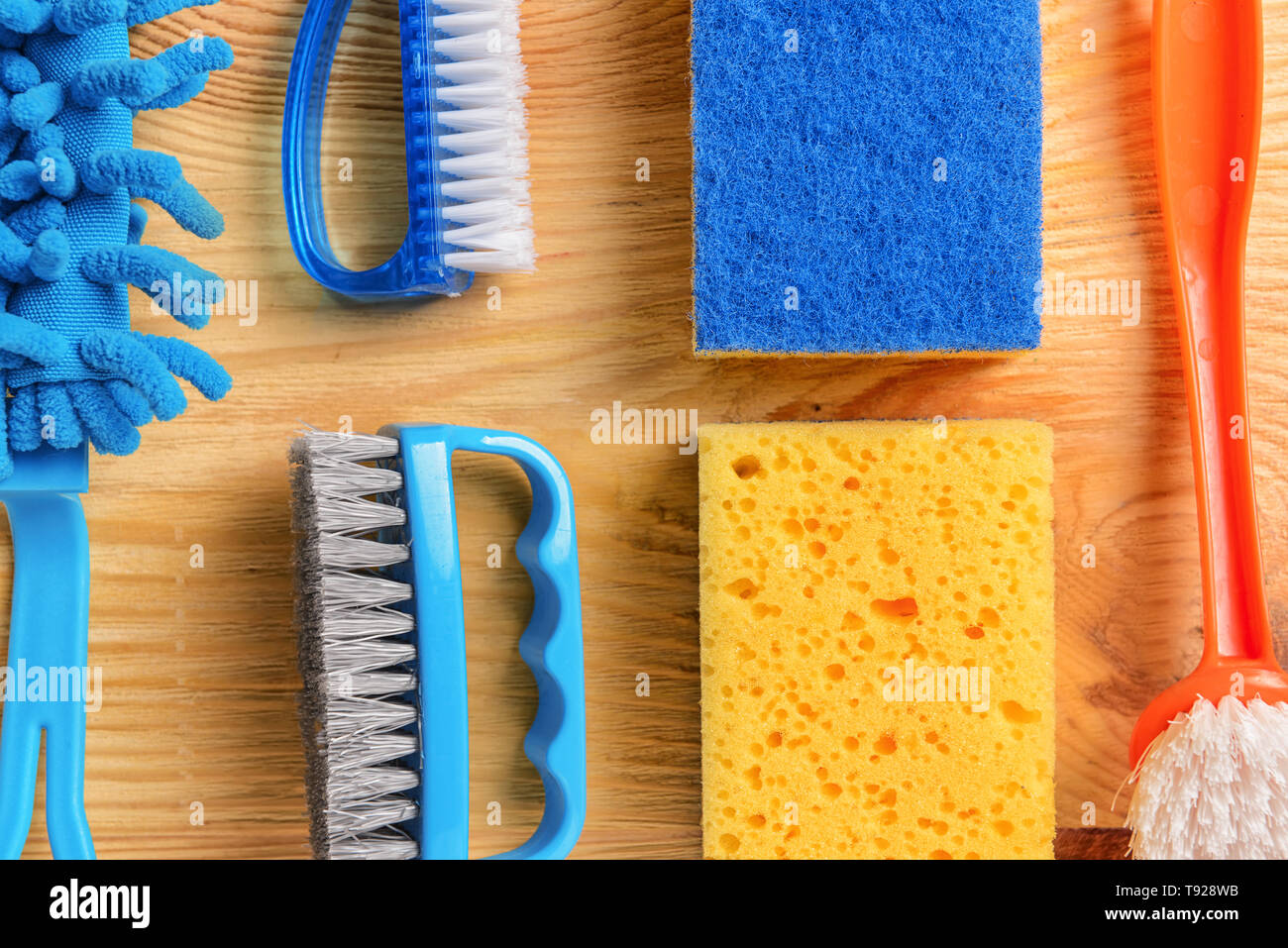 Flat lay composition with cleaning supplies on wooden background Stock ...