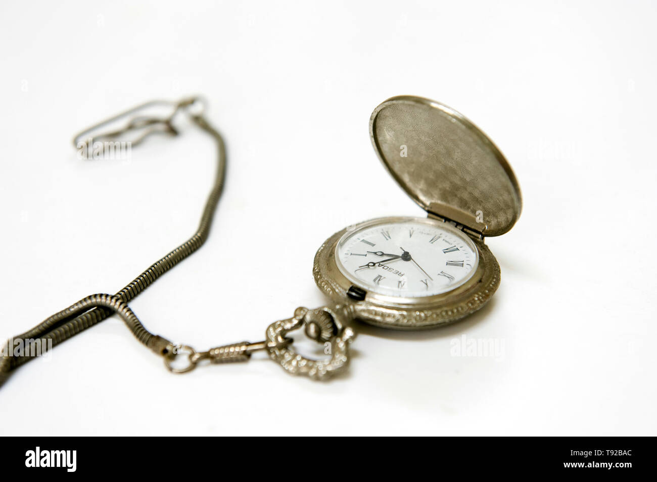 Pocket watch and ancient Chinese coins Stock Photo Alamy