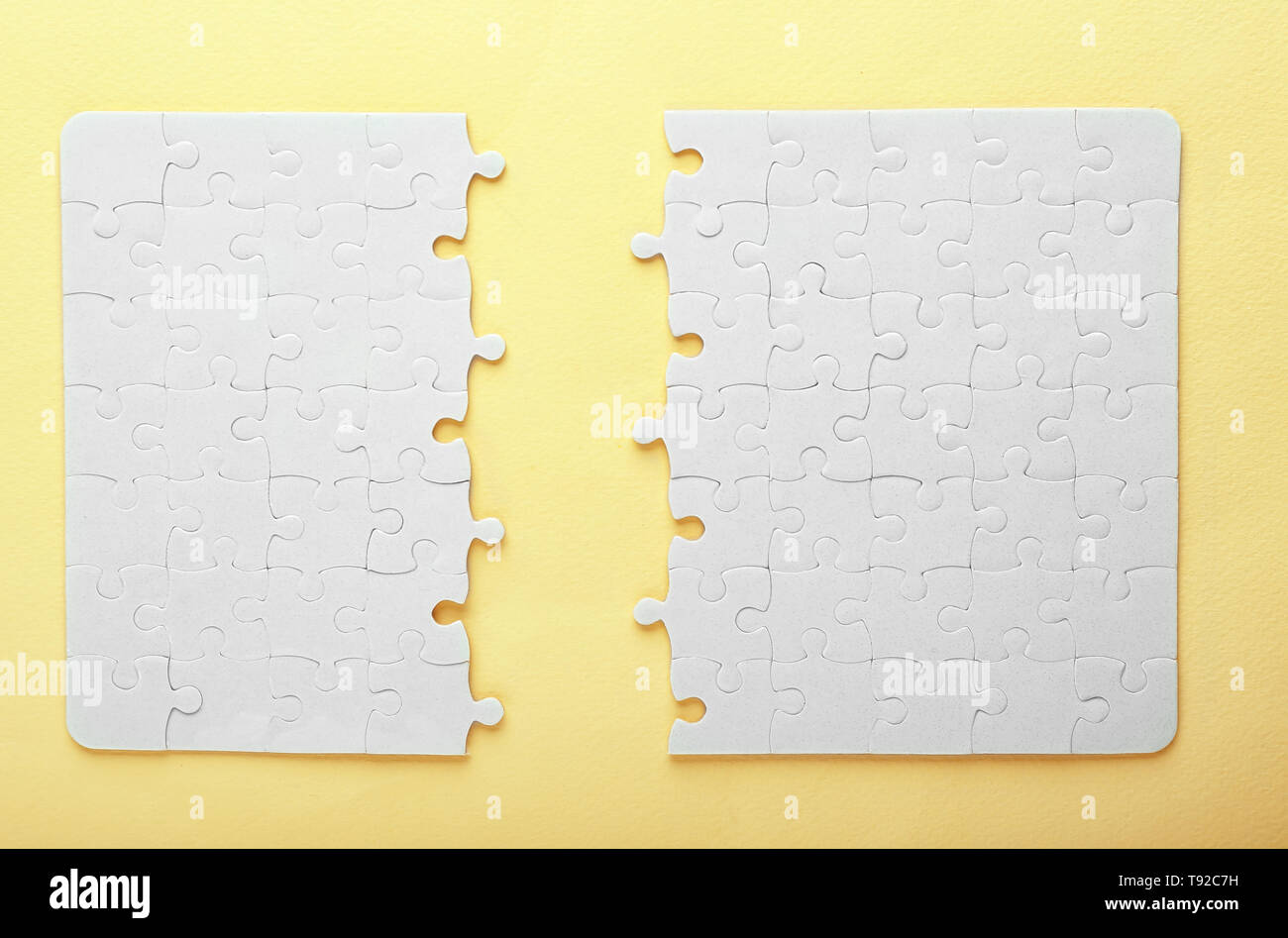 Incomplete jigsaw puzzle on color background Stock Photo - Alamy
