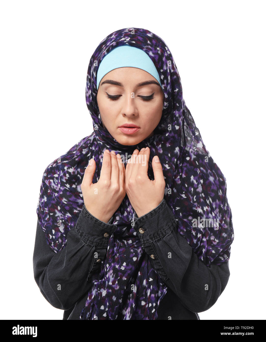 Young Muslim woman on white background Stock Photo - Alamy