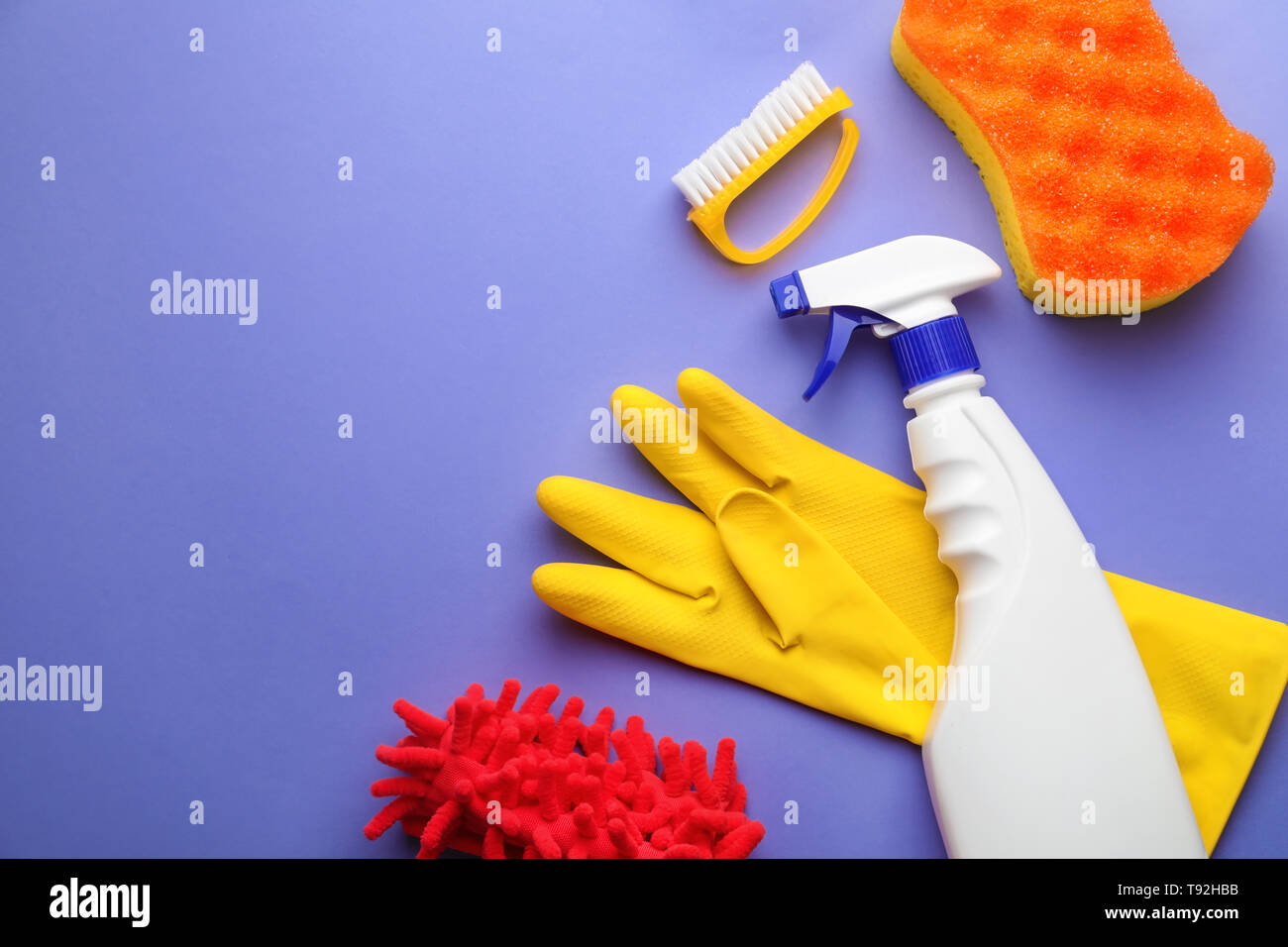 Flat lay composition with cleaning supplies on color background Stock ...