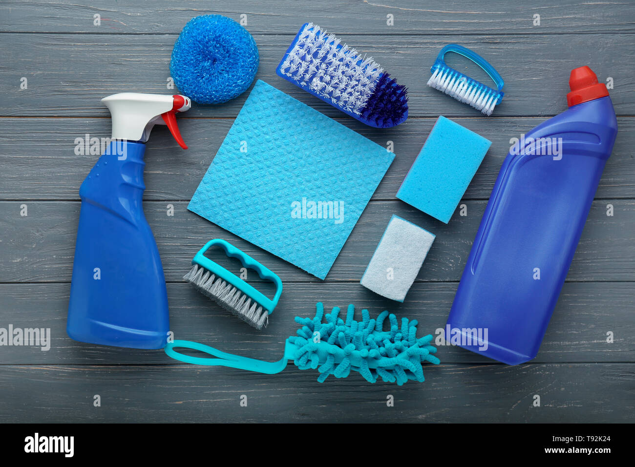 Flat lay composition with cleaning supplies on wooden background Stock ...