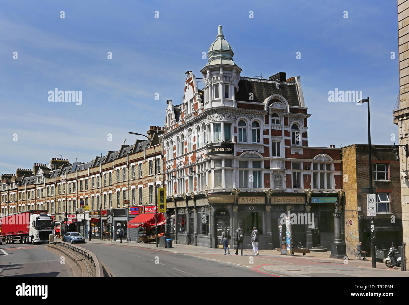 The New Cross pub and high street shops along on the A2 New Cross Road, Lewisham, South London. Ornate Victorian architecture. Stock Photo