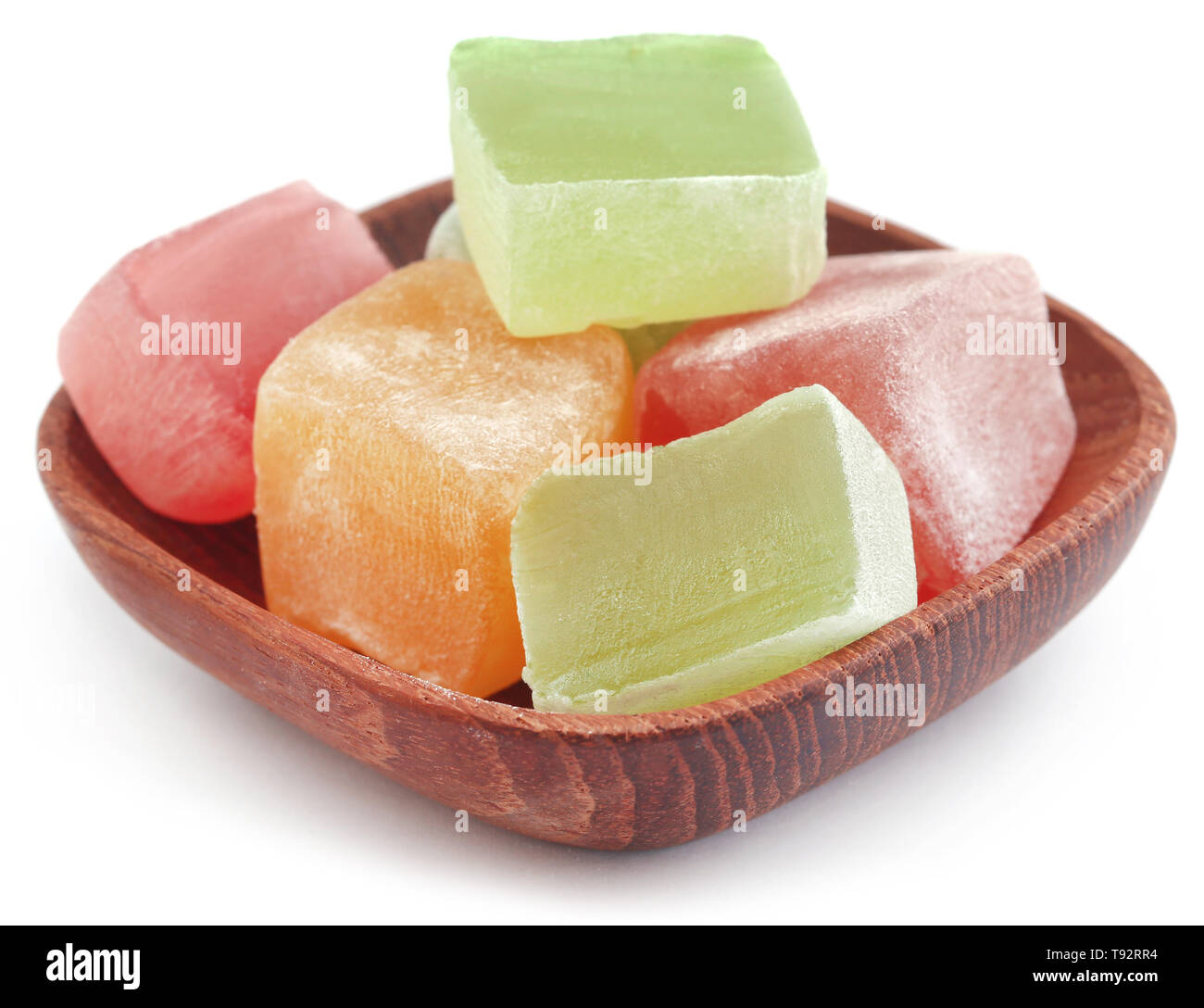 Turkish delight in a woden bowl over white background Stock Photo