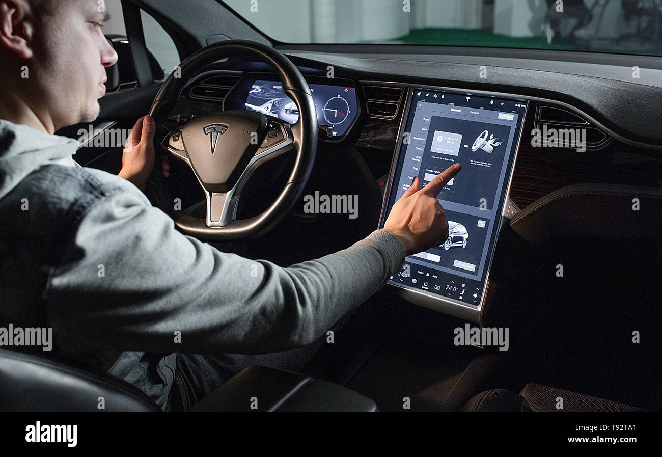 Inside view of Tesla Electric Vehicle. Sreering Wheel and Displays Stock Photo