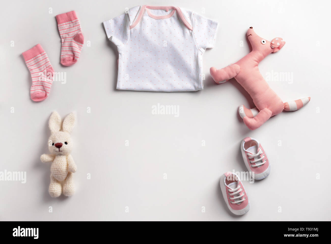 Cute baby clothes and toys on white background Stock Photo - Alamy