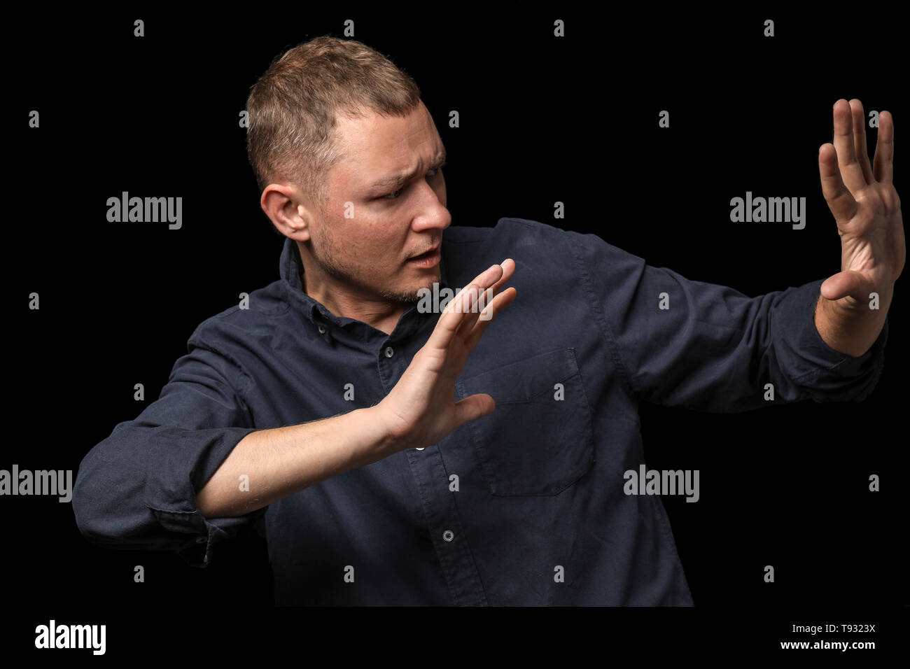 Man having panic attack on dark background Stock Photo