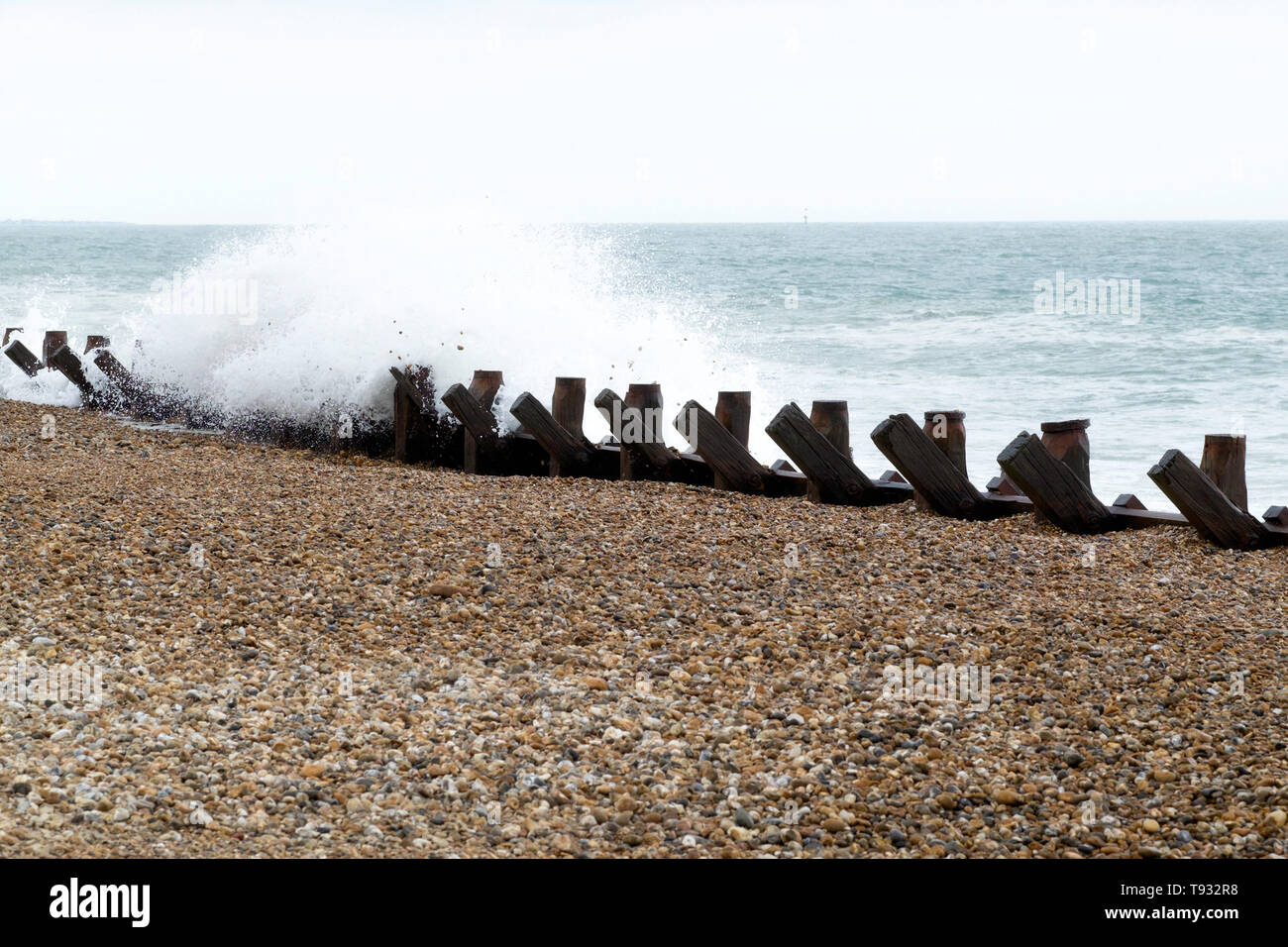 Waves crashing over the sea defences, Hayling Island, Hampshire, UK Stock Photo