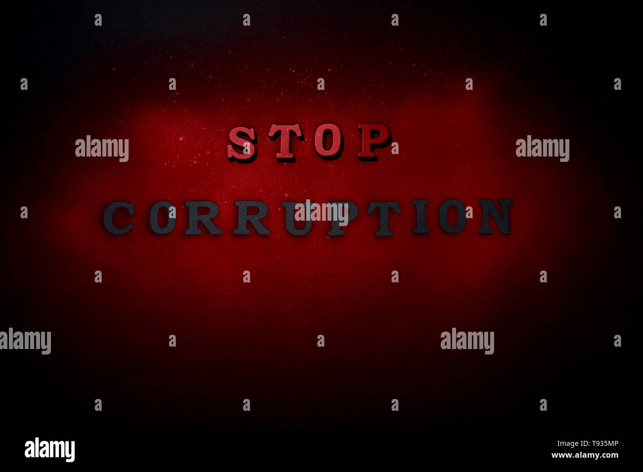 Text STOP CORRUPTION on dark background Stock Photo