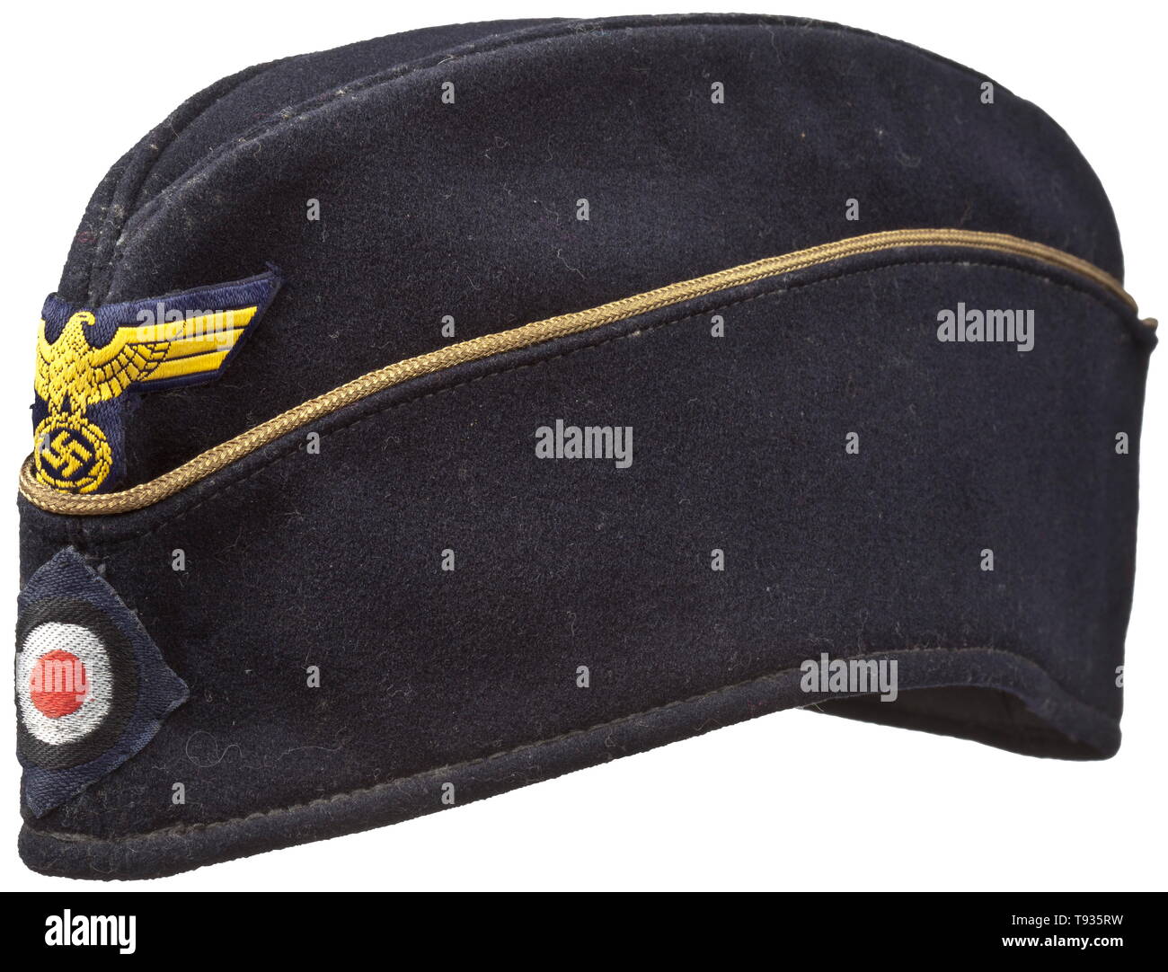 A 'Schiffchen' on-board cap for officers of the Kriegsmarine Depot piece of navy-blue woollen cloth, continuous golden officer's braid, black inner liner, BeVo weave insignia on a dark blue ground. Light signs of usage. historic, historical, navy, naval forces, military, militaria, branch of service, branches of service, armed forces, armed service, object, objects, stills, clipping, clippings, cut out, cut-out, cut-outs, 20th century, Editorial-Use-Only Stock Photo