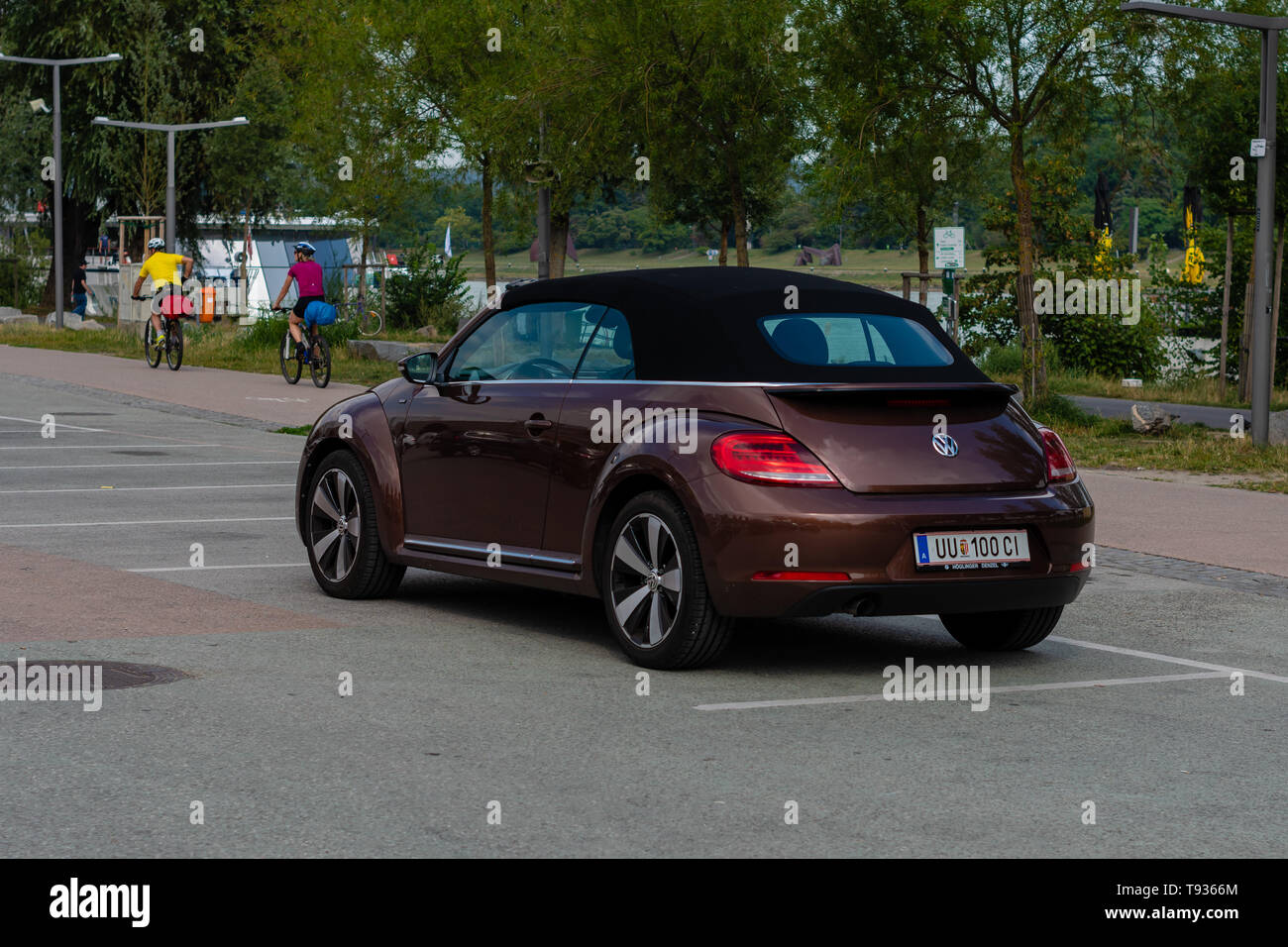 LINZ, AUSTRIA - AUGUST 02, 2018:   Side View Of Brown Volkswagen New Beetle Cabriolet Car Parked In Street. Stock Photo