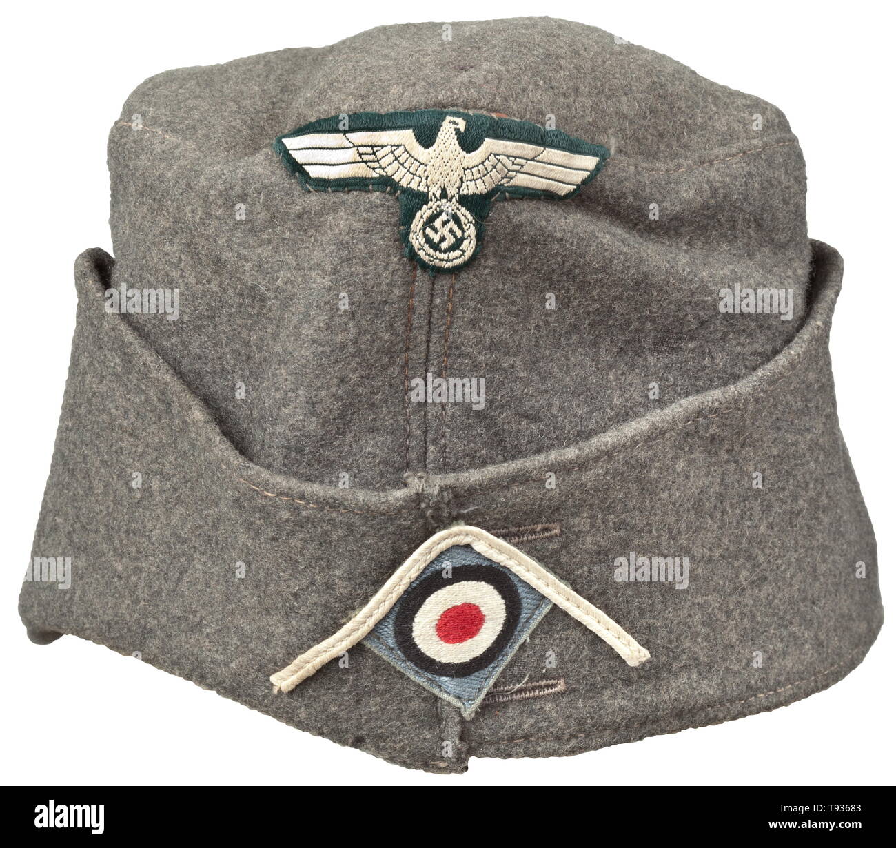 A garrison cap M 38 'Schiffchen' for enlisted men/NCOs adapted from an Austrian camp cap Depot piece in field-grey cloth, brown inner liner with depot stamping of the Vienna clothing office from the year 1938, leather sweatband, BeVo insignia (the cockade on a light grey ground). Lightly used condition. historic, historical, army, armies, armed forces, military, militaria, object, objects, stills, clipping, clippings, cut out, cut-out, cut-outs, 20th century, Editorial-Use-Only Stock Photo