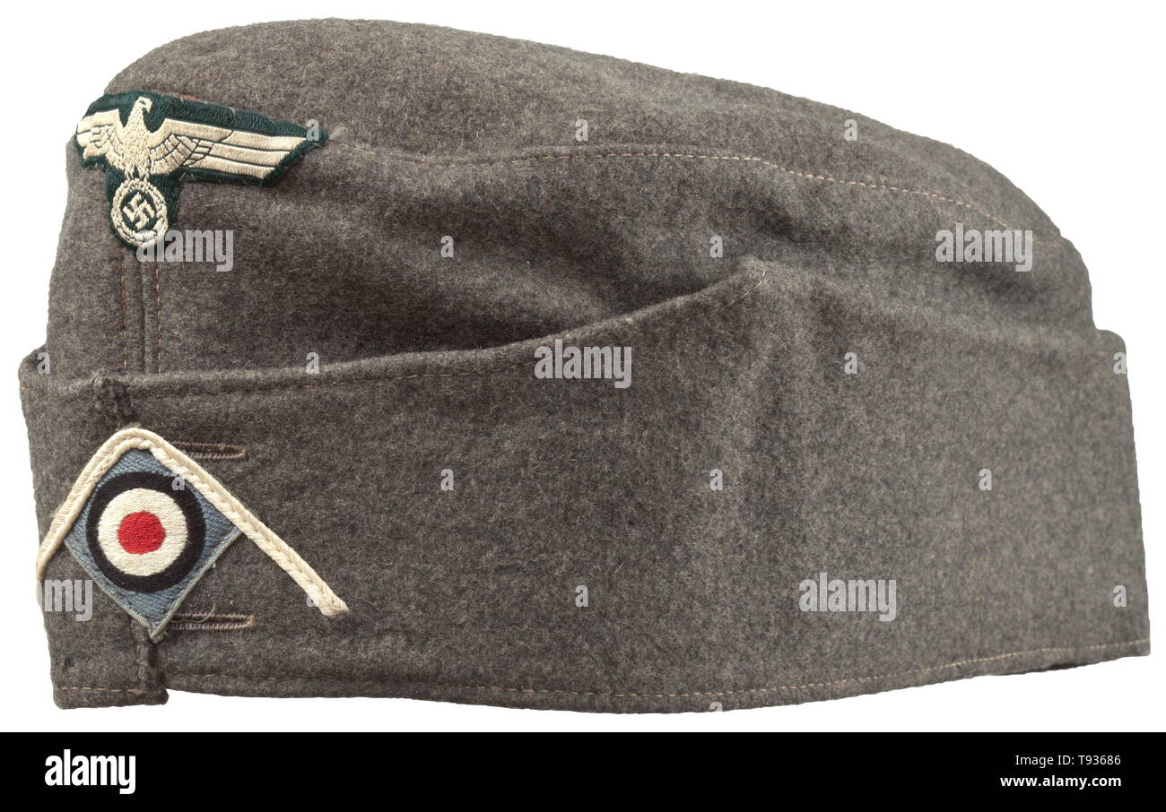 A garrison cap M 38 'Schiffchen' for enlisted men/NCOs adapted from an Austrian camp cap Depot piece in field-grey cloth, brown inner liner with depot stamping of the Vienna clothing office from the year 1938, leather sweatband, BeVo insignia (the cockade on a light grey ground). Lightly used condition. historic, historical, army, armies, armed forces, military, militaria, object, objects, stills, clipping, clippings, cut out, cut-out, cut-outs, 20th century, Editorial-Use-Only Stock Photo