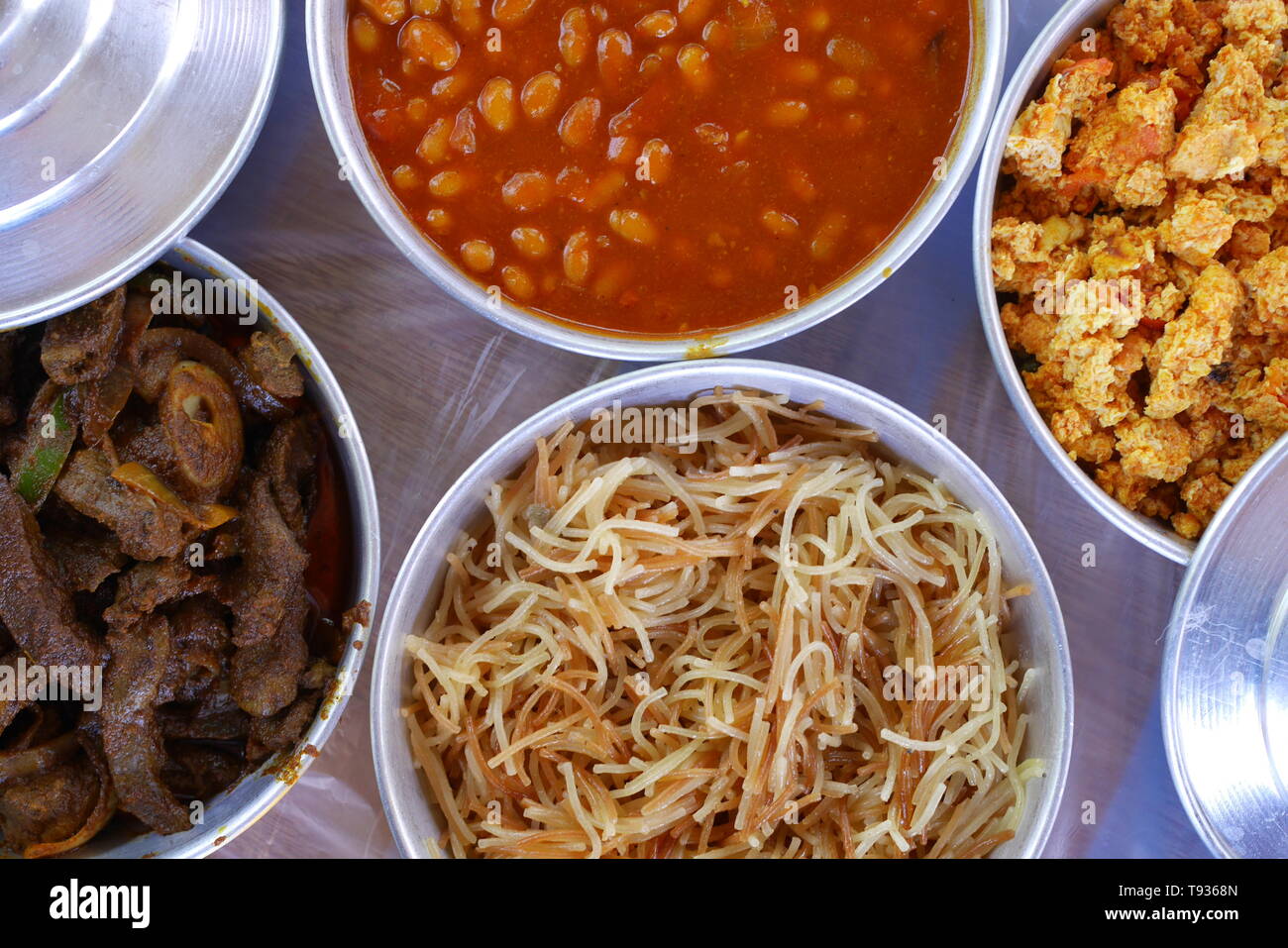 Bahrain breakfast of beans, balaleet, vermicelli, scrambled eggs