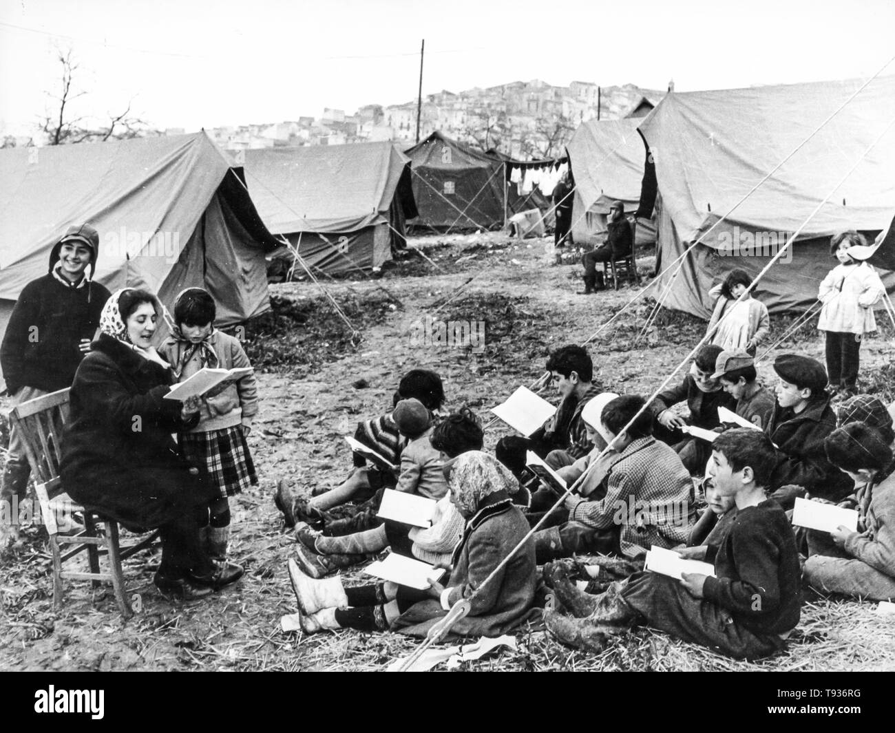 evacuees of agrigento's landslide, children during a school lesson in the campings, 1966 Stock Photo