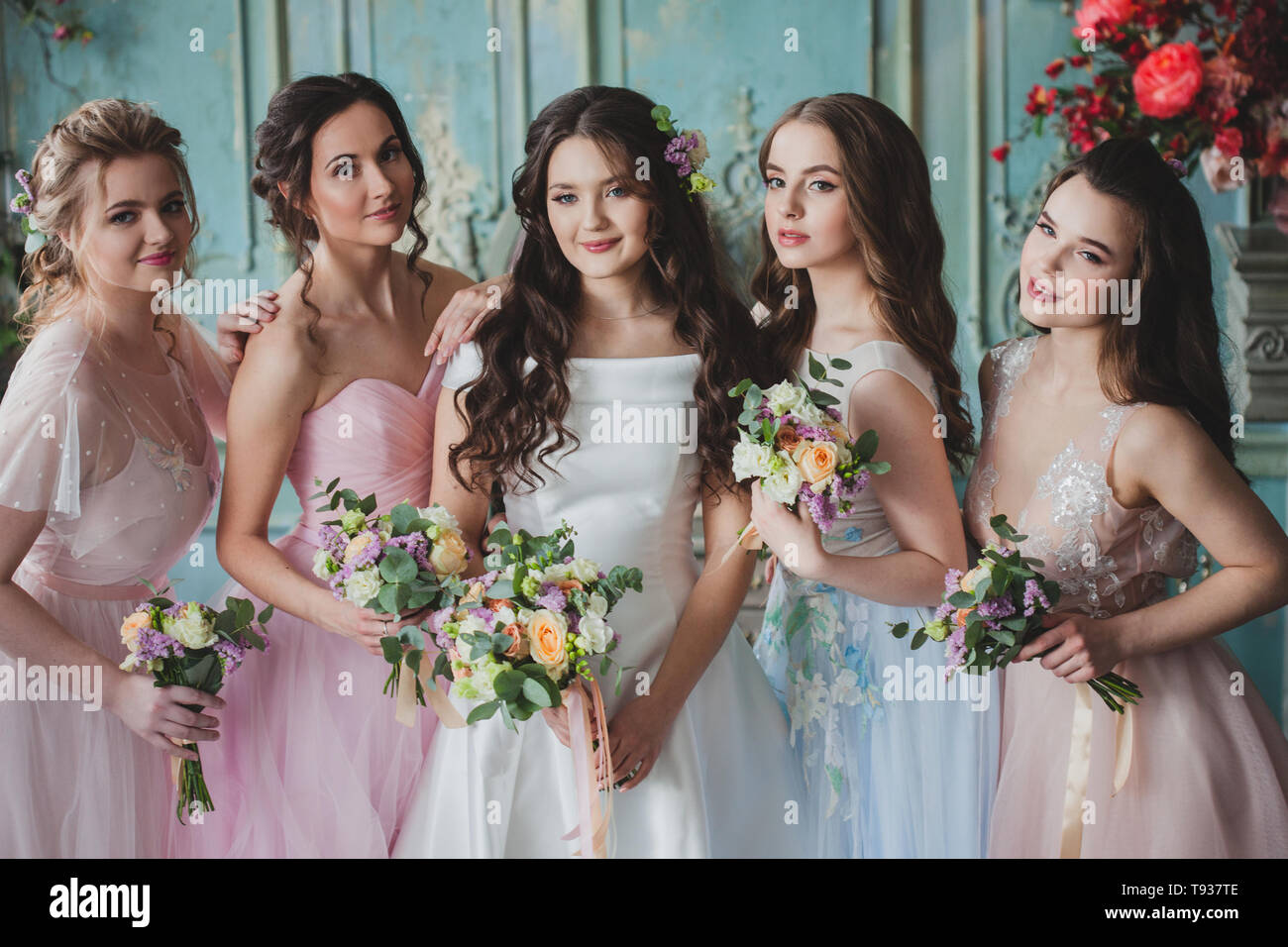 Beautiful young woman bride with friends. A wedding celebration, ladies in  splendid dresses Stock Photo - Alamy