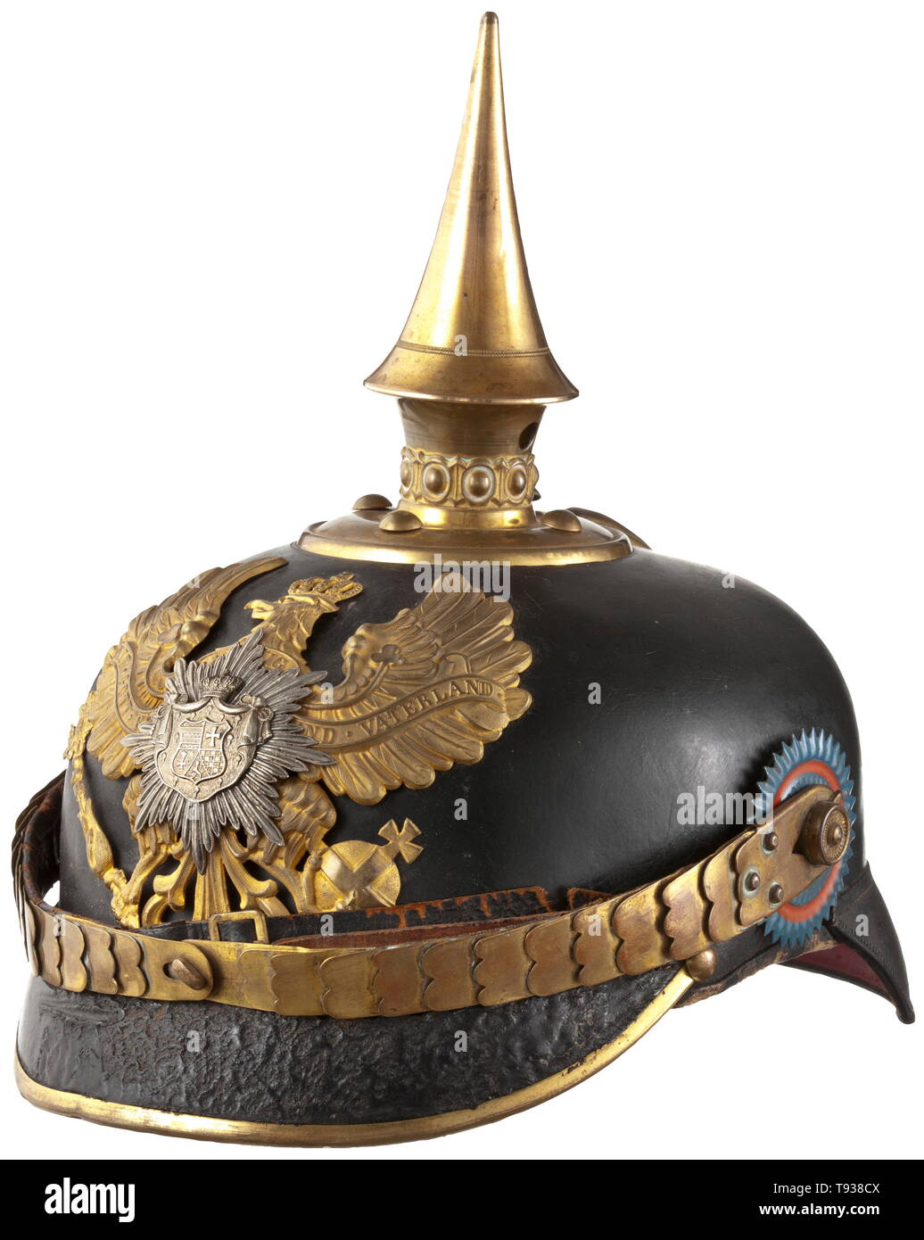 A helmet for troopers of the Oldenburg Infantry Regiment no. 91 Leather skull with round front visor (with craquelures), Prussian line eagle and additionally mounted star with the coat of arms of the Grand Duchy Oldenburg at centre. Spike base with four pins (one contemporarily added), with pearl ring and detachable spike. Straight chinscales on M 91 button, both trooper cockades with slight colour chippings, each in the original colour of the German Reich and Oldenburg, respectively. Officer type silk rep lining, red back visor (inside). Skull (, Additional-Rights-Clearance-Info-Not-Available Stock Photo