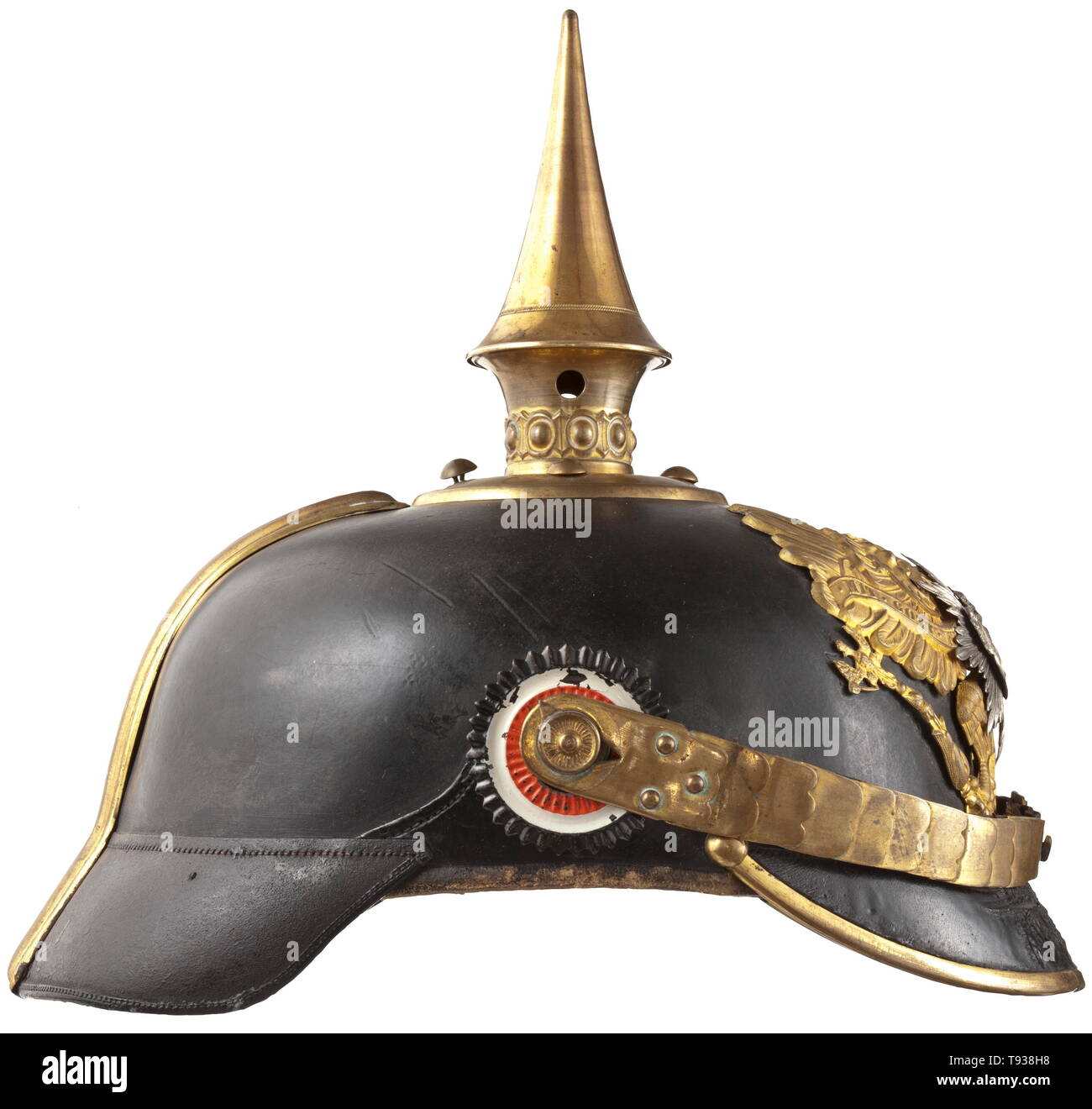 A helmet for troopers of the Oldenburg Infantry Regiment no. 91 Leather skull with round front visor (with craquelures), Prussian line eagle and additionally mounted star with the coat of arms of the Grand Duchy Oldenburg at centre. Spike base with four pins (one contemporarily added), with pearl ring and detachable spike. Straight chinscales on M 91 button, both trooper cockades with slight colour chippings, each in the original colour of the German Reich and Oldenburg, respectively. Officer type silk rep lining, red back visor (inside). Skull (, Additional-Rights-Clearance-Info-Not-Available Stock Photo