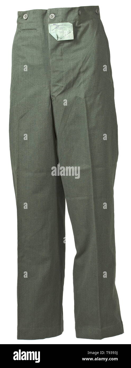 A pair of light field trousers for security service (SD) or SS personnel depot piece by the maker 'Oskowit'(?) in Moravia, 1943 Light summer trousers in mottled field-grey cotton with sheet metal buttons. Trousers raised at the back with buttons for attachment of suspenders, covered fly, two straight integrated pockets at the side seams, a fob pocket and an integrated back pocket with closure buttons, straight leg closures. Greenish silk liner with size stamp. Unused, with a sewn-in paper tag of the manufacturer. historic, historical, 20th century, 1930s, 1940s, Waffen-SS, , Editorial-Use-Only Stock Photo