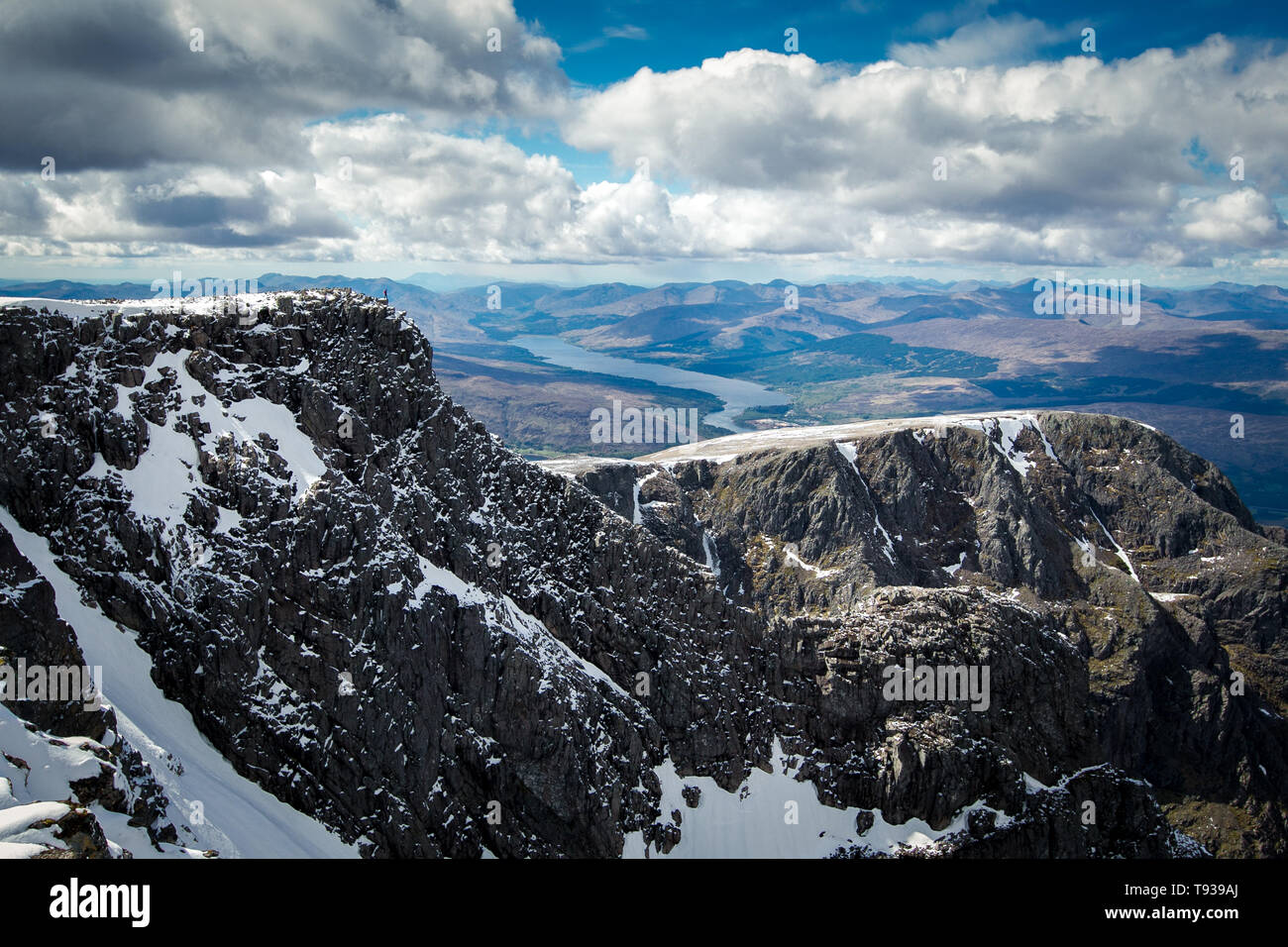 Climber on cliff edge of north face on Ben Nevis, Scotland. Stock Photo