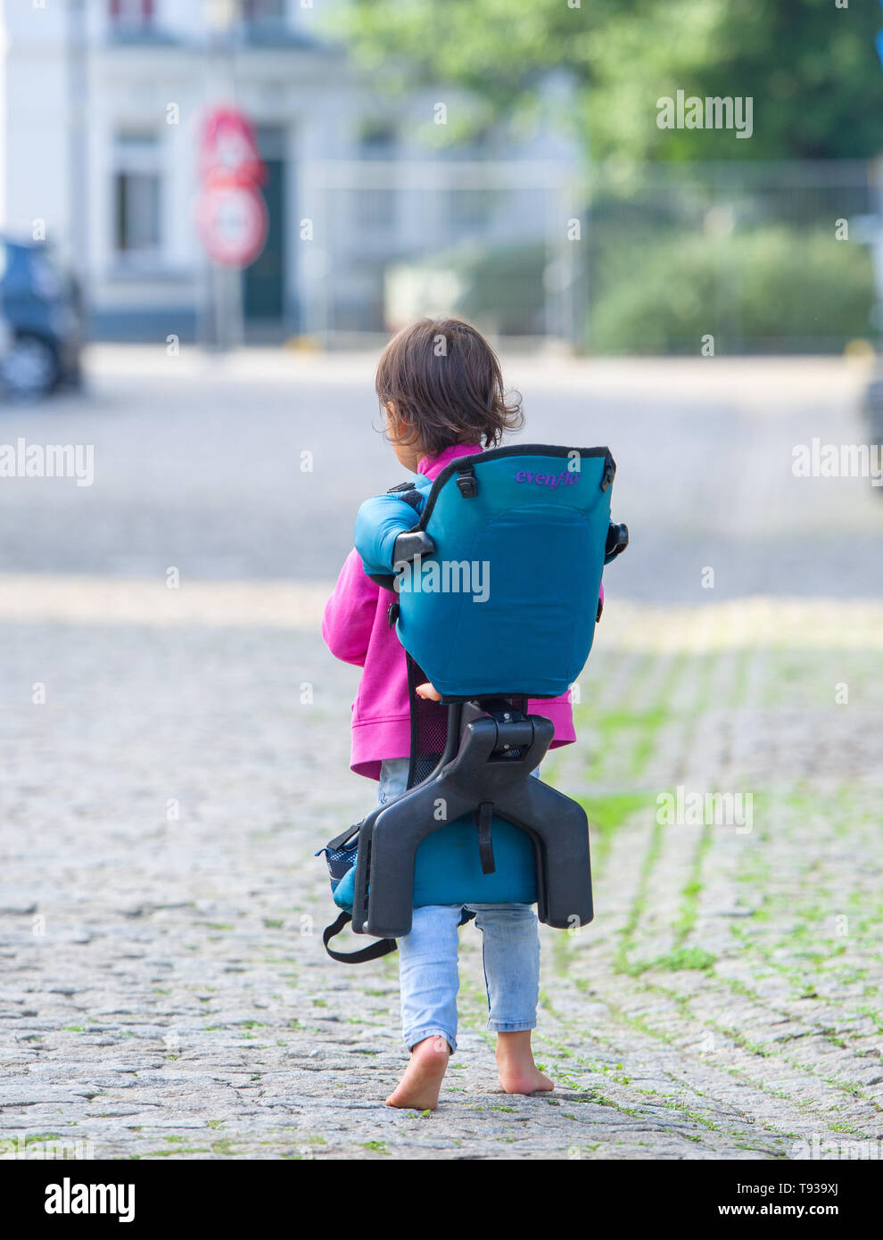 Little girl with a big backpack Stock Photo Alamy