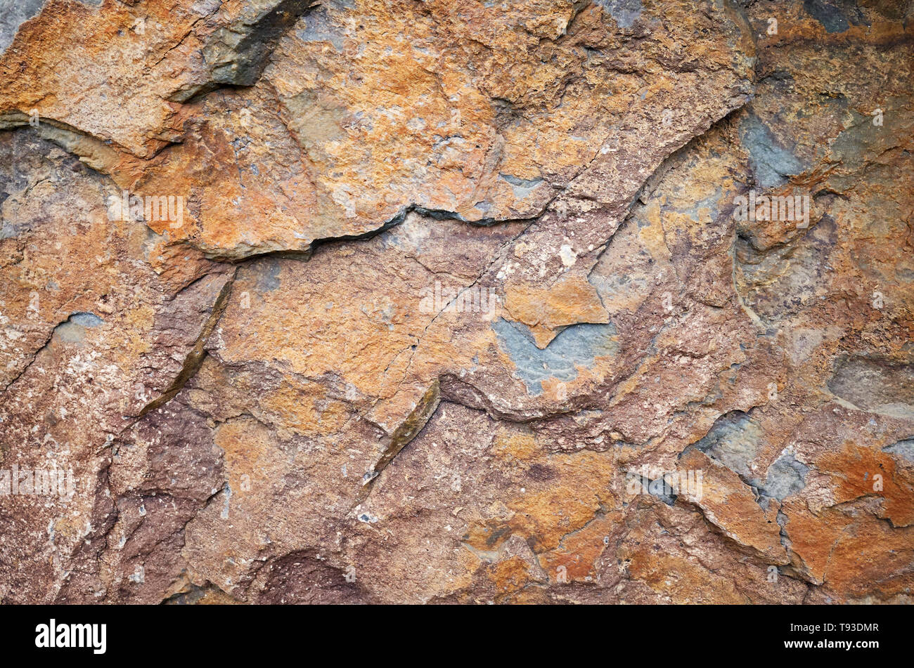 Close up picture of a rock surface, natural background or texture. Stock Photo